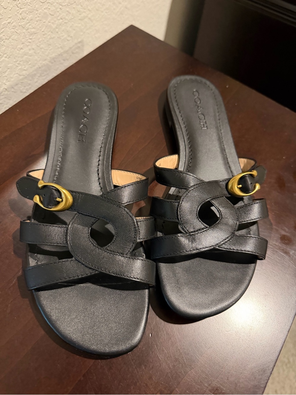 Coach Black Leather Slide Mules with Gold Buckle Accents